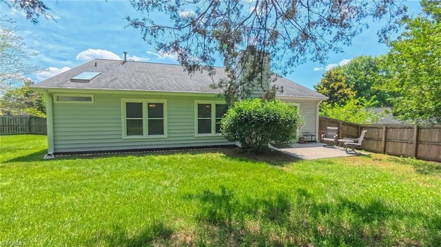 4401 Barndale Ct, Jamestown, NC 27282 - back of house with a fenced backyard, a patio, and roof with shingles