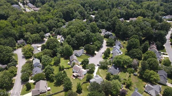 4401 Barndale Ct, Jamestown, NC 27282 - aerial view of property and surrounding area with a heavily wooded area and nearby suburban area