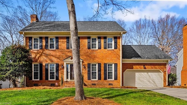 colonial-style house with a garage and a front lawn