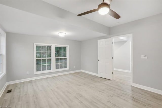 unfurnished room with ceiling fan and light hardwood / wood-style flooring