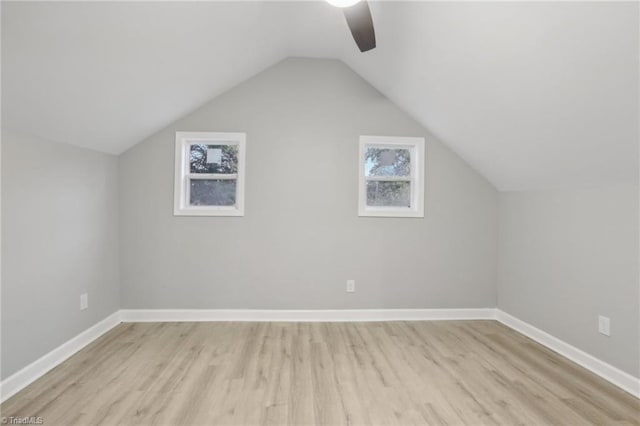 bonus room with ceiling fan, light hardwood / wood-style floors, and lofted ceiling