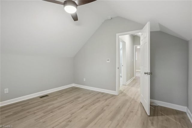 bonus room featuring lofted ceiling, ceiling fan, and light wood-type flooring