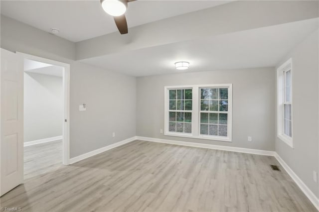 spare room featuring ceiling fan and light hardwood / wood-style flooring