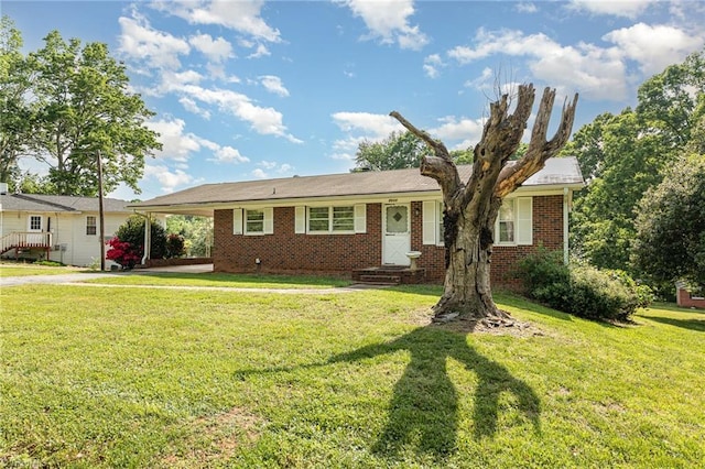 ranch-style house with brick siding, an attached carport, a front yard, and entry steps