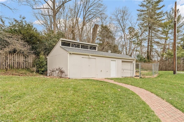 view of outbuilding featuring fence and an outdoor structure