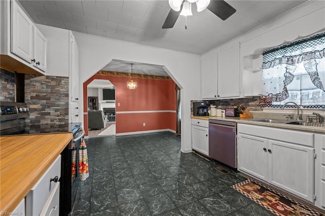 2719 NC Highway 87, Graham, NC 27253 - kitchen with stainless steel appliances, arched walkways, a sink, a ceiling fan, and tasteful backsplash