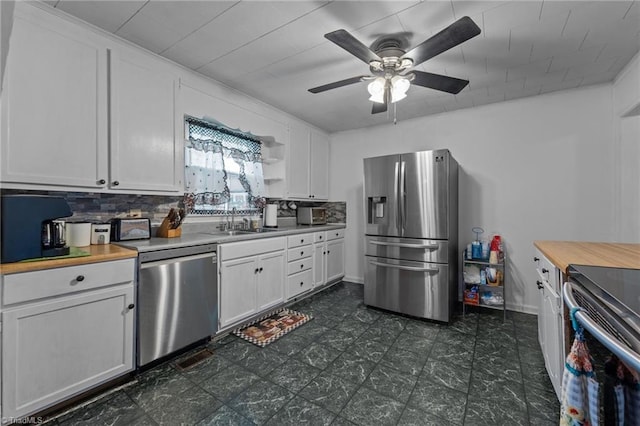 2719 NC Highway 87, Graham, NC 27253 - kitchen featuring appliances with stainless steel finishes, a sink, white cabinets, and a ceiling fan