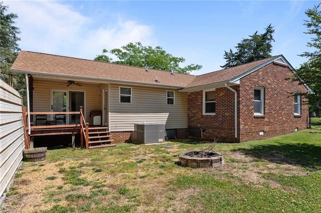 2719 NC Highway 87, Graham, NC 27253 - back of house featuring an outdoor fire pit, cooling unit, a deck, a yard, and ceiling fan