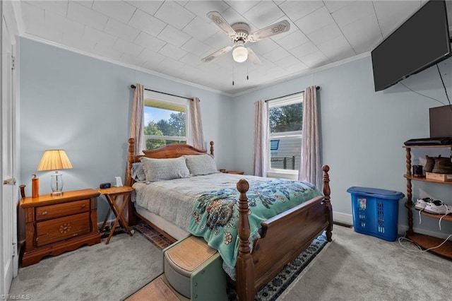 2719 NC Highway 87, Graham, NC 27253 - carpeted bedroom featuring multiple windows, ornamental molding, ceiling fan, and baseboards