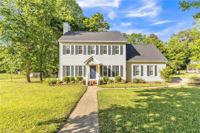 colonial-style house with a chimney