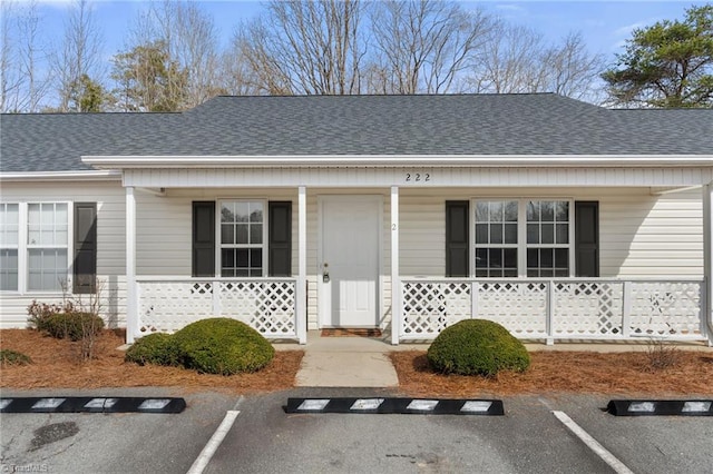 view of exterior entry featuring a porch