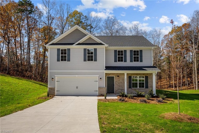 craftsman-style home featuring an attached garage, driveway, brick siding, and a front yard