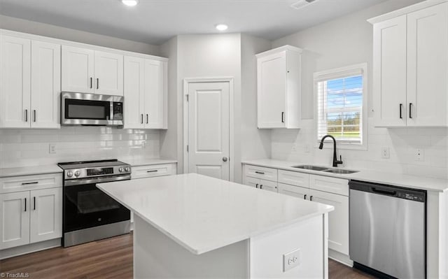 4196 Emmas Way E, Bend, NC 27018 - kitchen featuring appliances with stainless steel finishes, a sink, light countertops, and recessed lighting