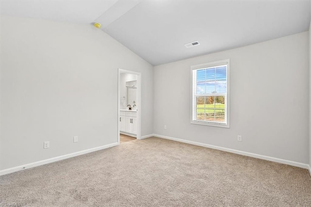 4196 Emmas Way E, Bend, NC 27018 - unfurnished room with light colored carpet, baseboards, and lofted ceiling