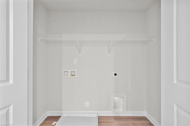 4196 Emmas Way E, Bend, NC 27018 - clothes washing area with electric dryer hookup, hookup for a washing machine, hookup for a gas dryer, light wood-style floors, and baseboards