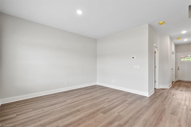 4196 Emmas Way E, Bend, NC 27018 - spare room with light wood finished floors, baseboards, and recessed lighting
