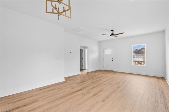 unfurnished living room with ceiling fan and light hardwood / wood-style floors