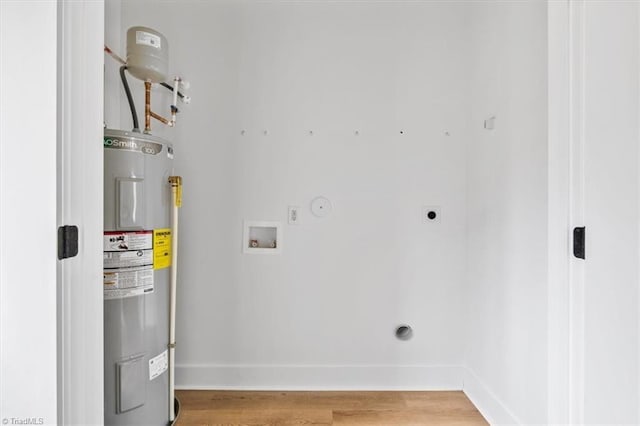 utility room featuring electric water heater