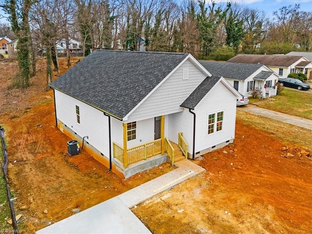 view of front of house featuring cooling unit