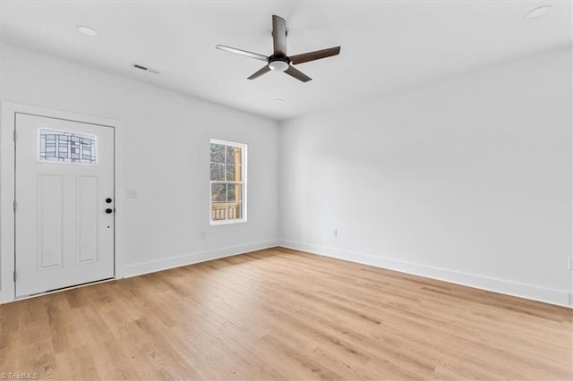 foyer entrance featuring ceiling fan and light wood-type flooring