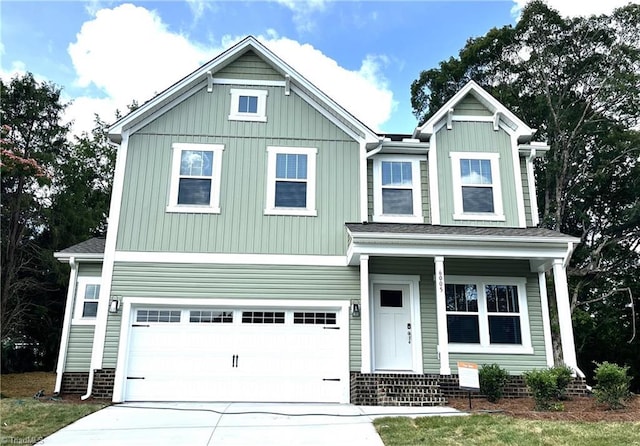 6005 Crestridge Ln Unit 1005, Winston-Salem, NC 27105 - view of front facade with a garage, driveway, a porch, and board and batten siding