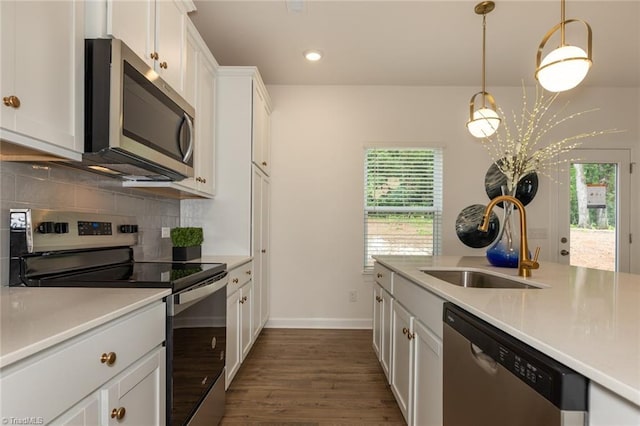 6005 Crestridge Ln Unit 1005, Winston-Salem, NC 27105 - kitchen featuring appliances with stainless steel finishes, decorative backsplash, dark wood-type flooring, white cabinets, and recessed lighting