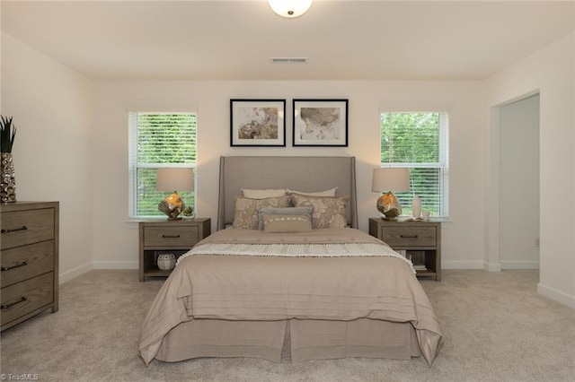 6005 Crestridge Ln Unit 1005, Winston-Salem, NC 27105 - bedroom with light carpet and multiple windows
