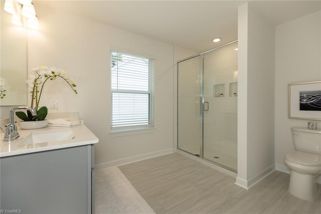6005 Crestridge Ln Unit 1005, Winston-Salem, NC 27105 - bathroom with double vanity, a stall shower, wood finished floors, and recessed lighting