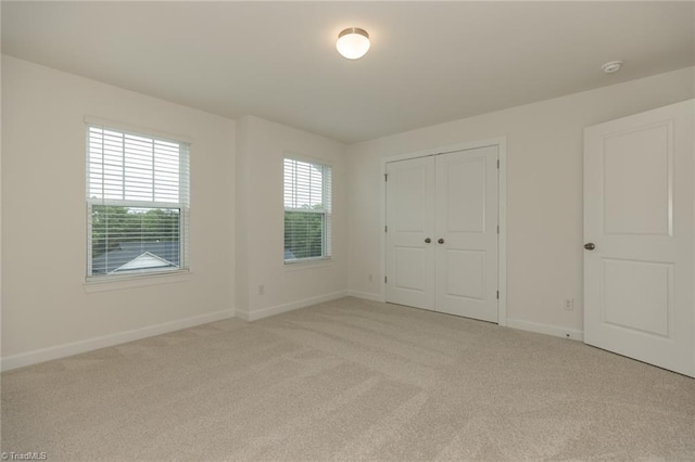 6005 Crestridge Ln Unit 1005, Winston-Salem, NC 27105 - unfurnished bedroom with light colored carpet and a closet