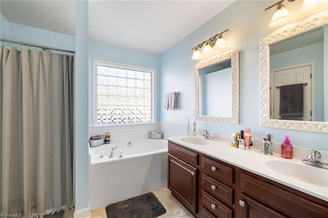 full bath with double vanity, a garden tub, and a sink