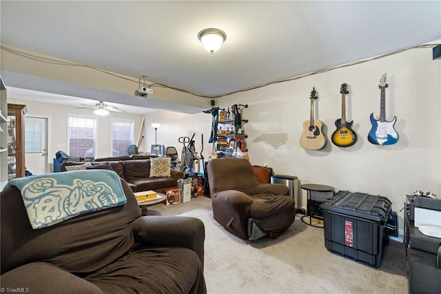 living area with carpet floors and ceiling fan