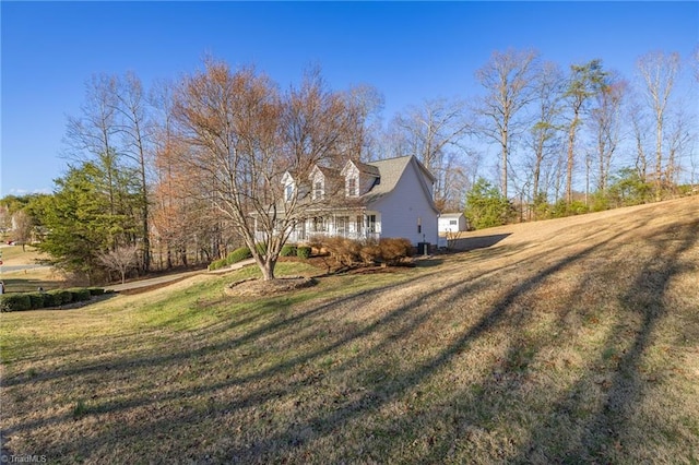 view of side of property featuring a lawn