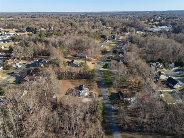 drone / aerial view with a view of trees