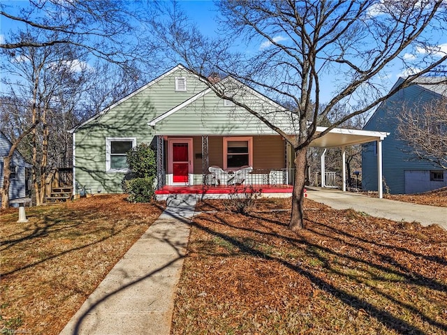 bungalow featuring a carport and covered porch