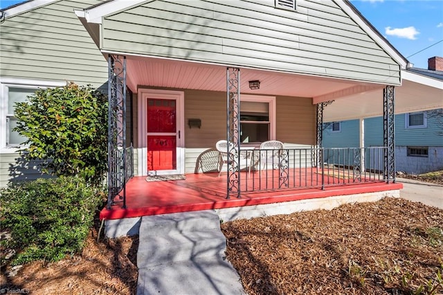 view of exterior entry featuring a porch