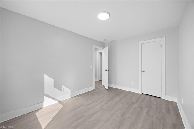220 Glen Ter, Mount Airy, NC 27030 - unfurnished bedroom featuring wood finished floors and baseboards