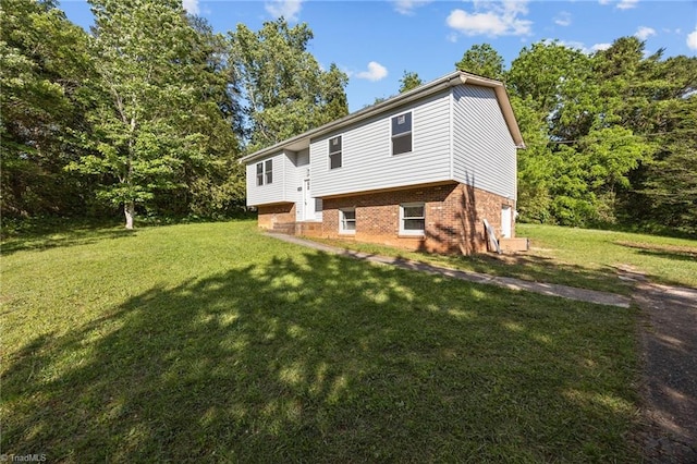 220 Glen Ter, Mount Airy, NC 27030 - back of house with a lawn and brick siding
