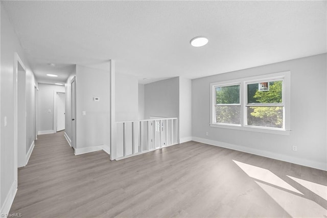 220 Glen Ter, Mount Airy, NC 27030 - spare room featuring wood finished floors, baseboards, and a textured ceiling
