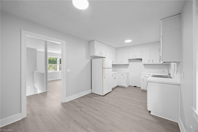 220 Glen Ter, Mount Airy, NC 27030 - kitchen with freestanding refrigerator, a sink, light wood finished floors, and baseboards