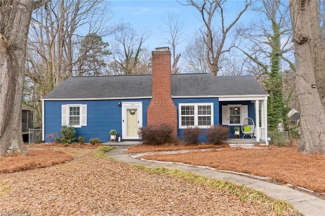 single story home featuring covered porch