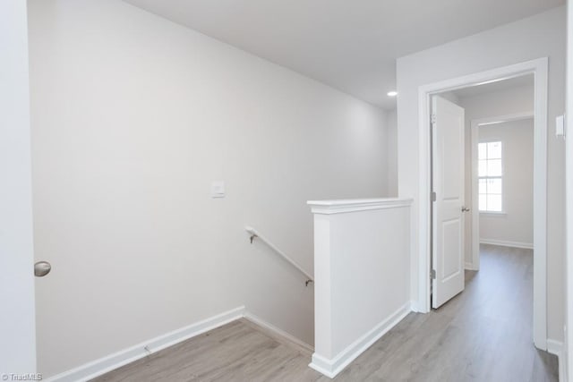 5504 Avery Dr, Trinity, NC 27370 - hall with an upstairs landing, light wood-style flooring, baseboards, and recessed lighting