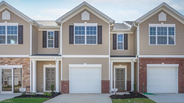 5504 Avery Dr, Trinity, NC 27370 - view of property with an attached garage, brick siding, and concrete driveway