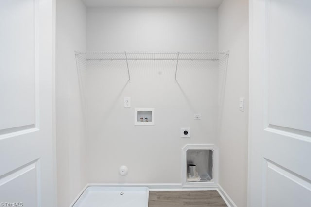 5504 Avery Dr, Trinity, NC 27370 - washroom with hookup for a gas dryer, washer hookup, hookup for an electric dryer, wood finished floors, and baseboards