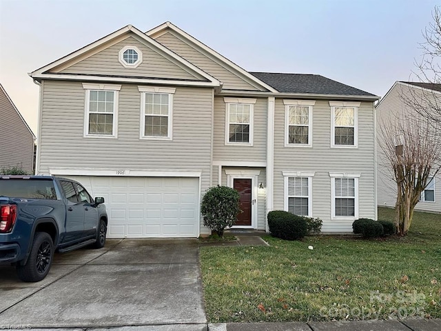 view of front of home with a garage, concrete driveway, and a front yard