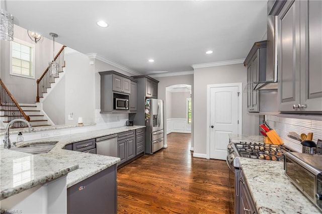3632 Sally Kirk Rd, Winston-Salem, NC 27106 - kitchen with appliances with stainless steel finishes, gray cabinets, a sink, ornamental molding, and arched walkways