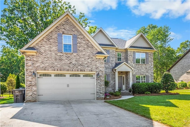 3632 Sally Kirk Rd, Winston-Salem, NC 27106 - view of front facade featuring driveway, a front yard, an attached garage, brick siding, and board and batten siding