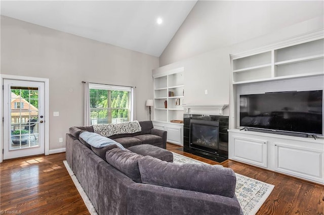 3632 Sally Kirk Rd, Winston-Salem, NC 27106 - living room with high vaulted ceiling, dark wood-style flooring, a fireplace with flush hearth, recessed lighting, and baseboards