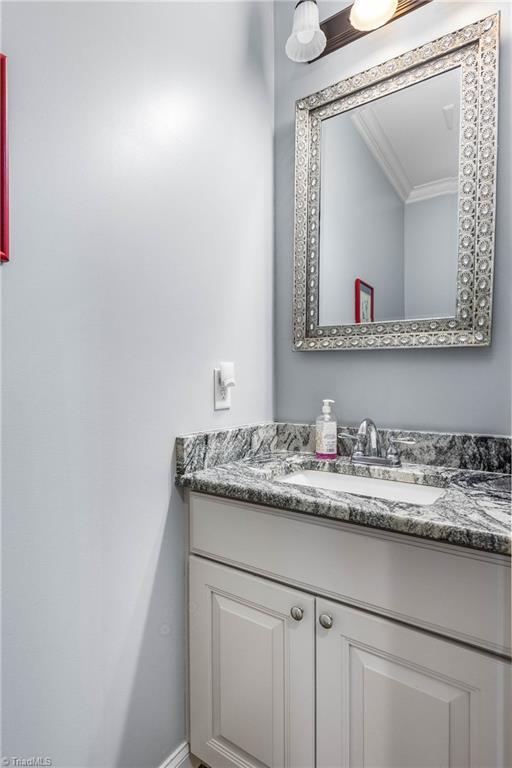 3632 Sally Kirk Rd, Winston-Salem, NC 27106 - bathroom with vanity and crown molding