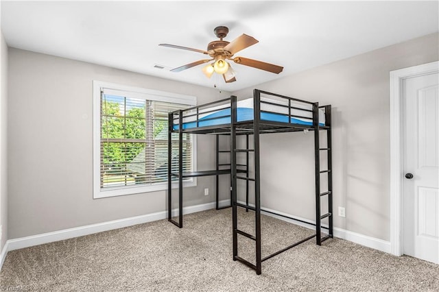 3632 Sally Kirk Rd, Winston-Salem, NC 27106 - unfurnished bedroom with baseboards, carpet floors, and a ceiling fan