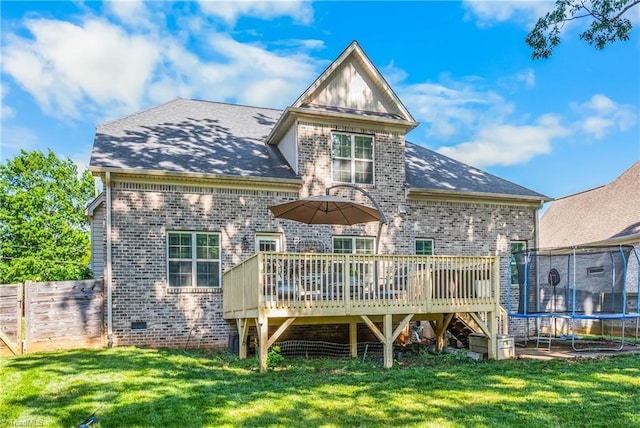 3632 Sally Kirk Rd, Winston-Salem, NC 27106 - rear view of property featuring a trampoline, brick siding, a deck, and crawl space